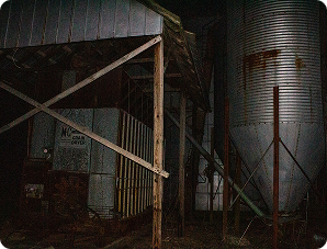 pavillion and silo outside in the middle of the night