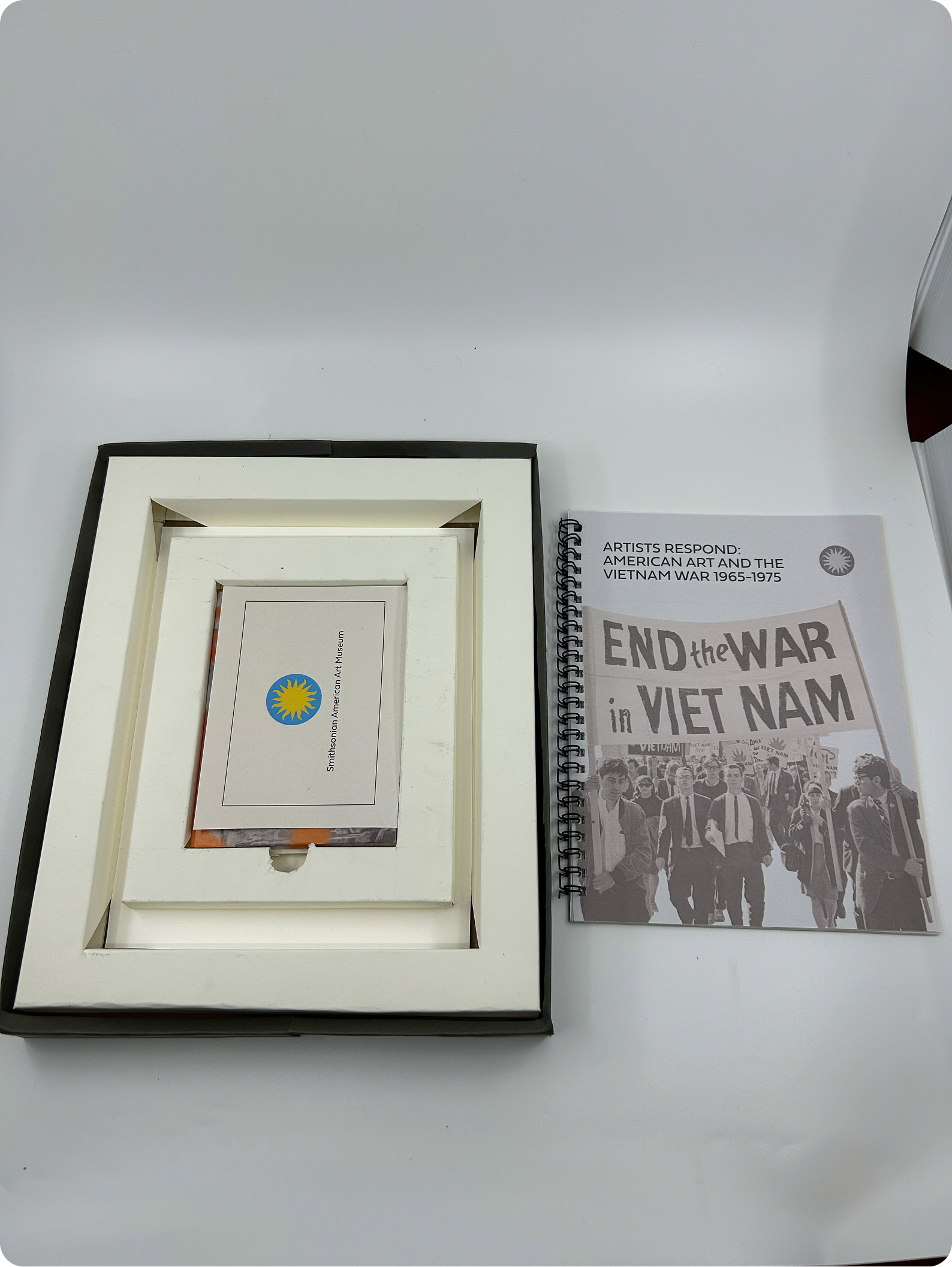 Box containing donor card, with the museum catalog next to the box